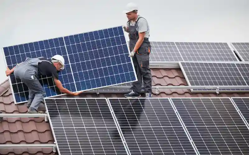 home owner installing solar panels